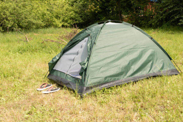 Green tent in the garden for camping